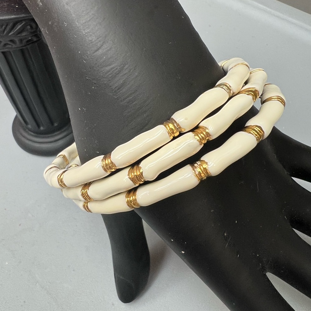 Three ivory  faux, bamboo stacking bracelets with gold accents. Lily Pulitzer